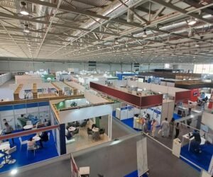 people-visiting-trade-show-with-many-stands-booths_581196-423